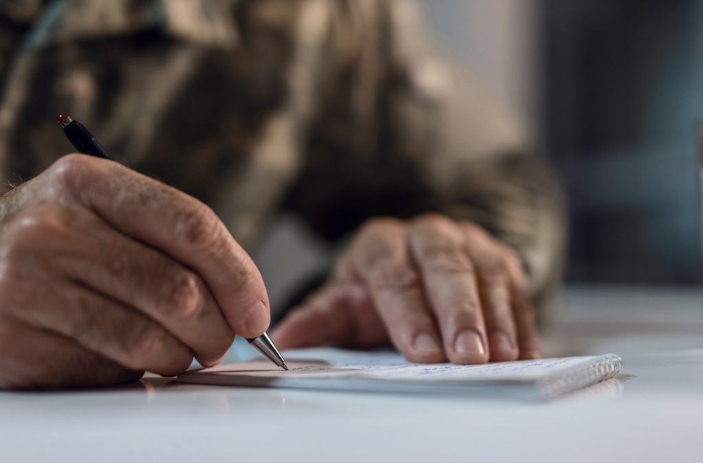 elderly gentleman writing a letter